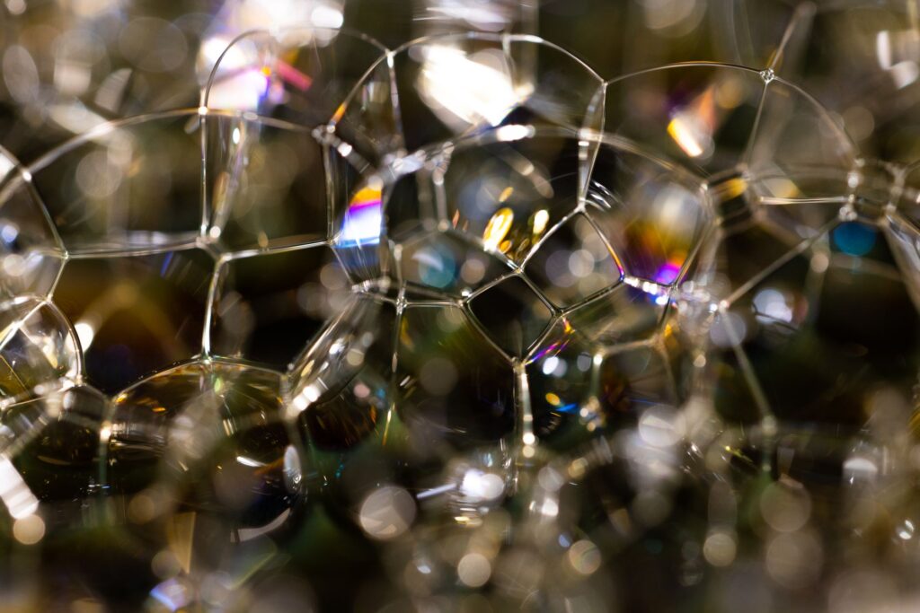A captivating close-up of shining soap bubbles with vibrant iridescent colors, an image for Does the Multiverse Explain Away Fine-Tuning
