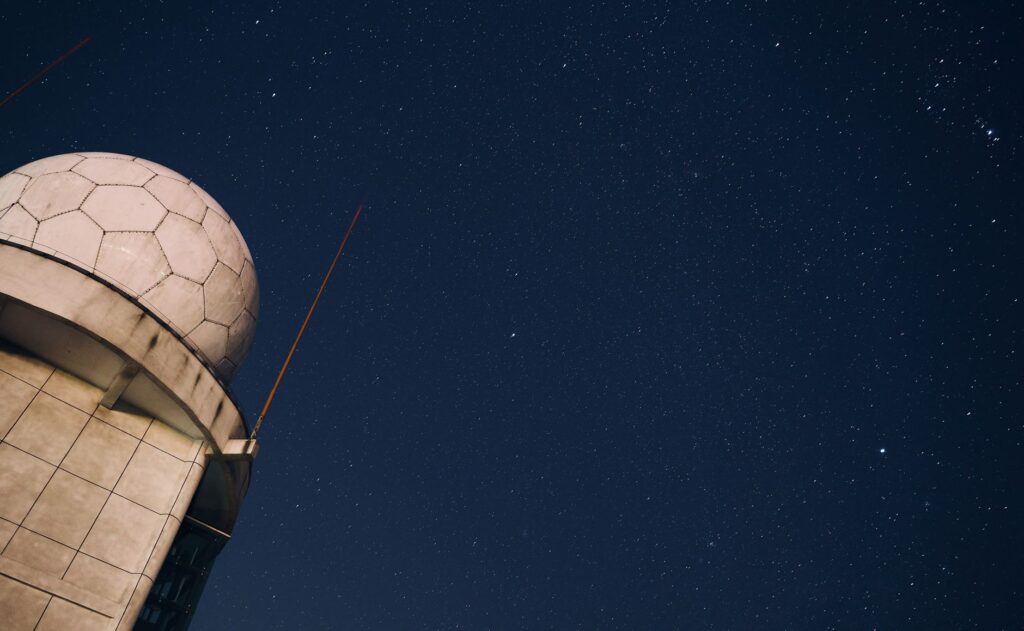 A stunning view of a starry night sky above an observatory dome, capturing the beauty of the cosmos.