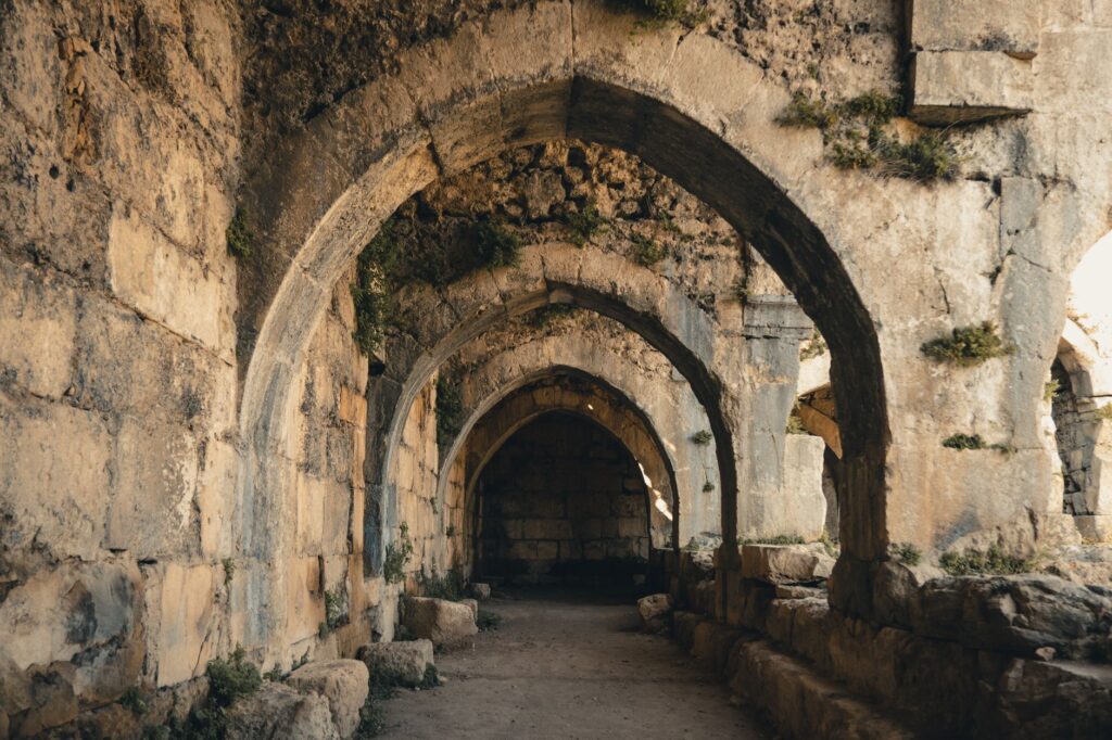 Explore the timeless beauty of an ancient stone archway in this captivating image of historical ruins.