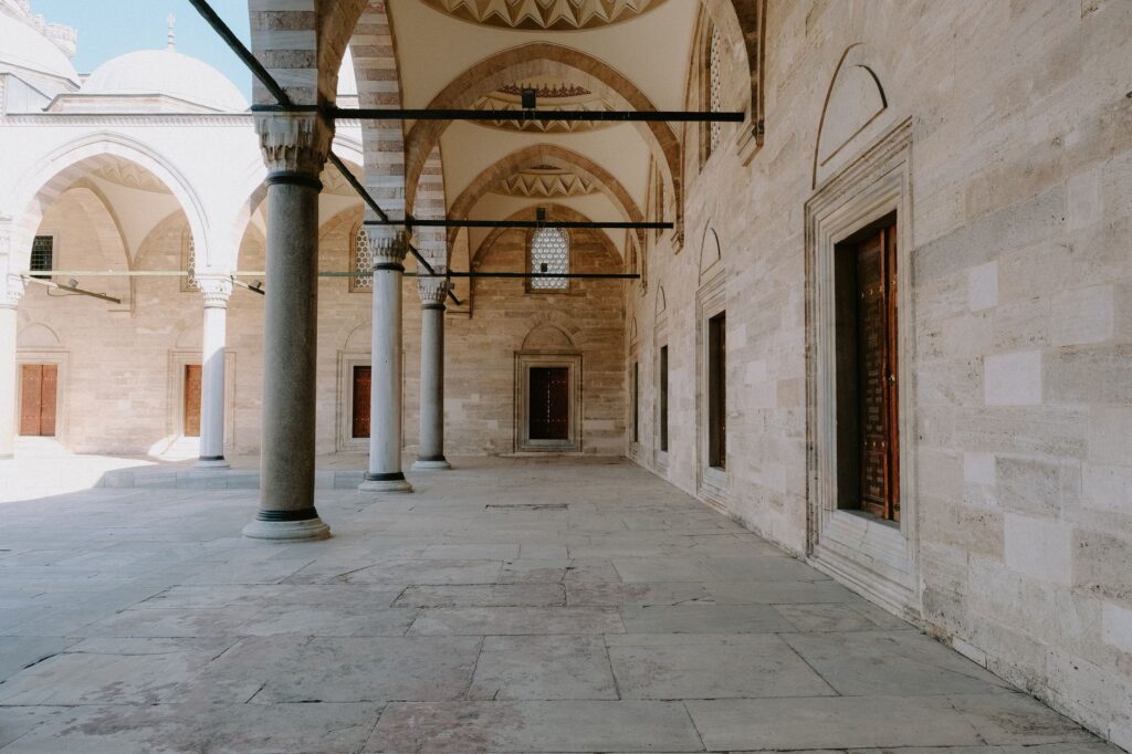 Elegant Ottoman architecture of mosque courtyard with stone arches and columns, an image for The Islam I Was Defending Did Not Exist
