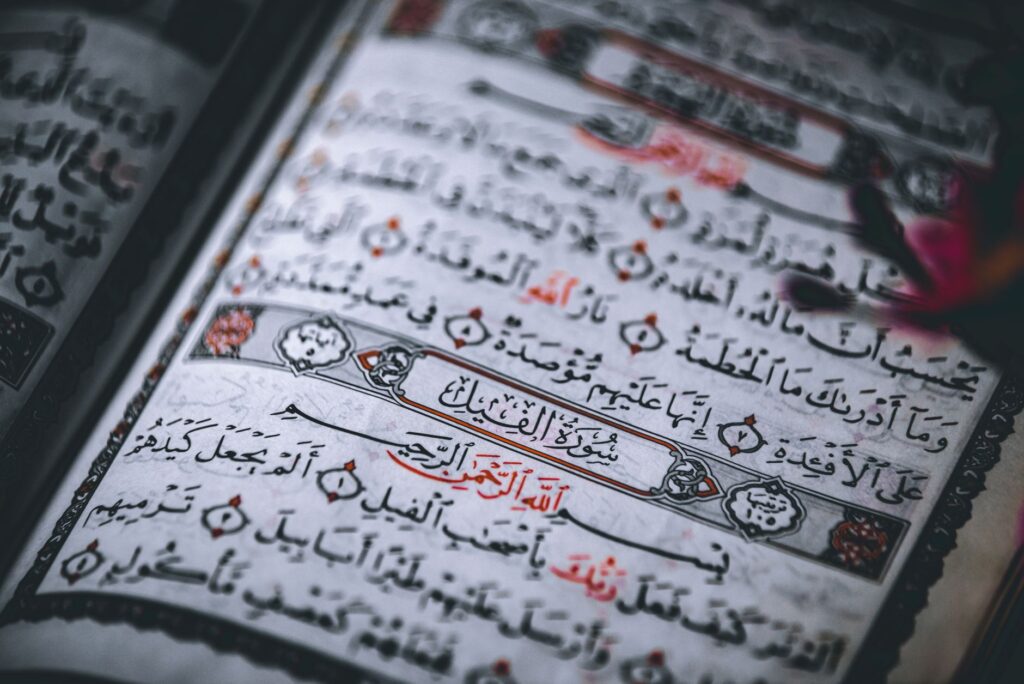 Detailed close-up of the Quran showing Arabic calligraphy and intricate designs, an image for Arabic Prayer: Why Pray in Arabic if God Understands All Languages