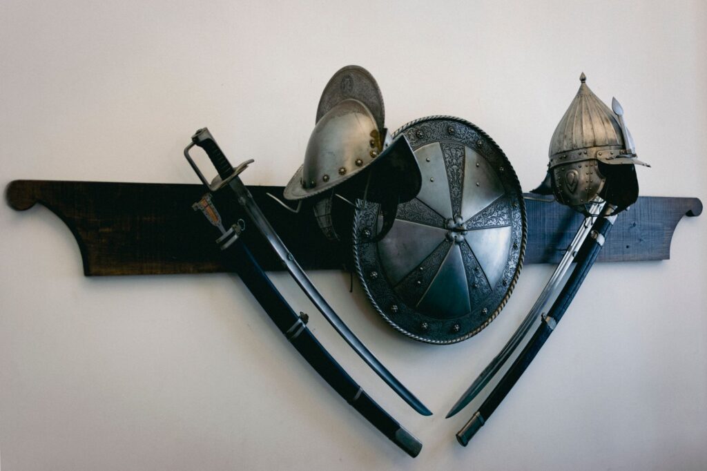 Historic medieval armor and weapons displayed on a wall in Nesvizh, Belarus museum.