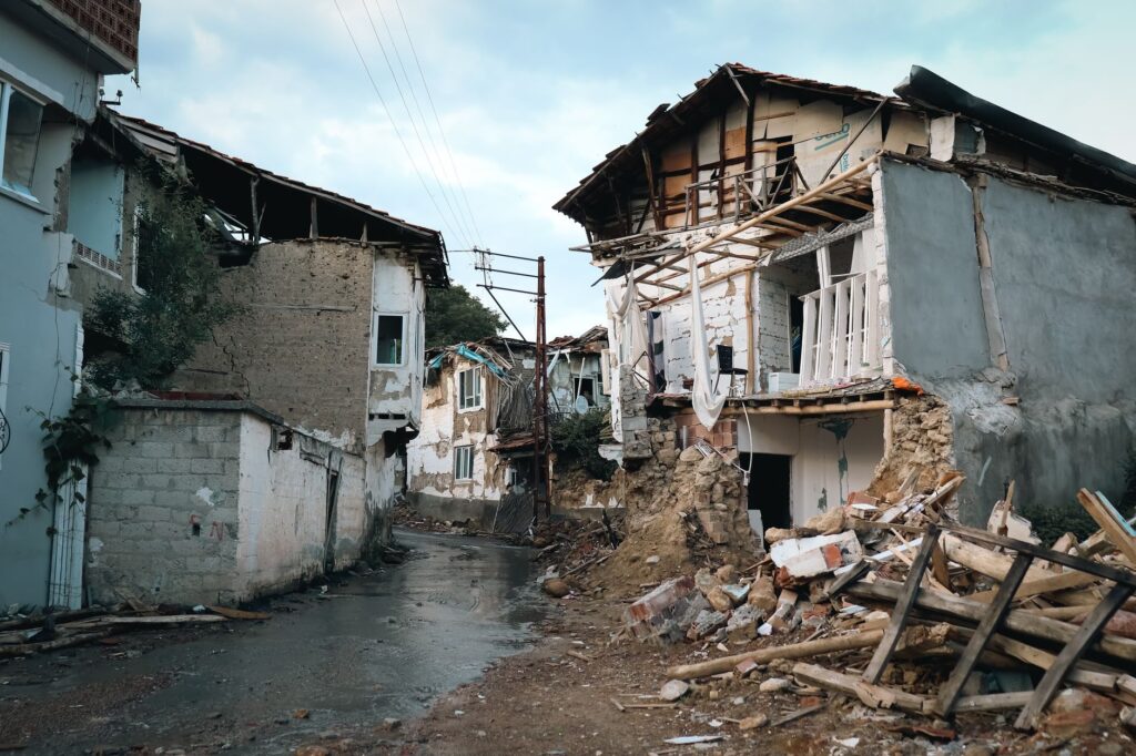 Destroyed buildings in an urban area after an earthquake, an image for Natural Evil: Earthquakes, Cancer, and a Good God