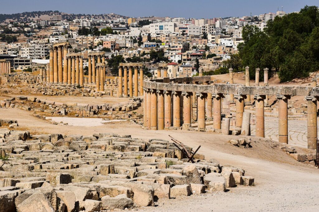 Explore the ancient Roman ruins of Jerash with its iconic colonnade and cityscape views.