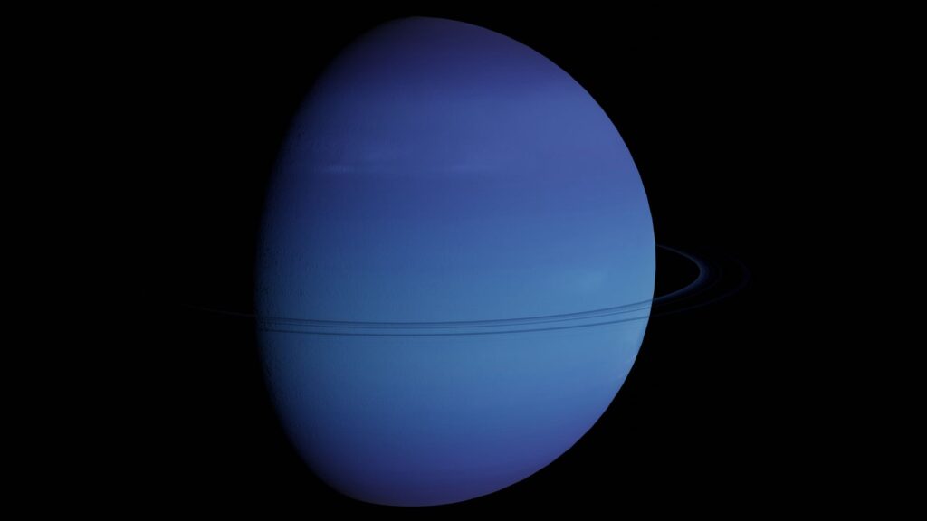 Vibrant blue image of Neptune and its rings in the vastness of space.