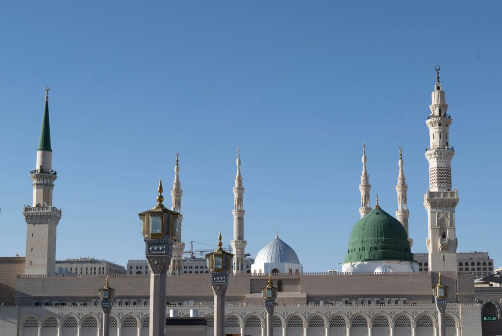 Iconic view of Al-Masjid an-Nabawi minarets against a clear blue sky in Medina, Saudi Arabia, an image for Muhammad: Was He Who He Claimed to Be