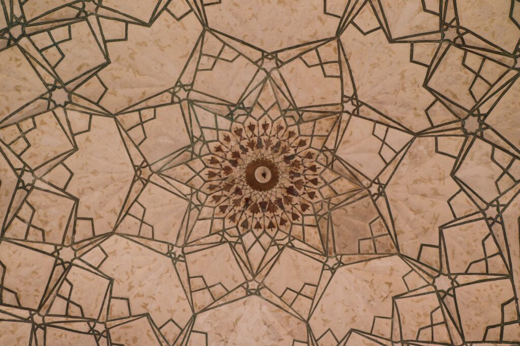 Stunning Islamic geometric design on a ceiling in New Delhi, India, showcasing intricate symmetry and craftsmanship.