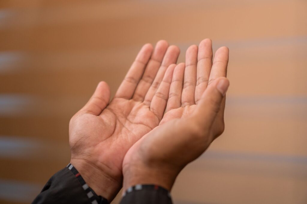 Close-up of hands in prayer gesture, symbolizing Islamic devotion. Captured indoors in Sulawesi Selatan, Indonesia, an image for Unanswered Prayer: If God Listens, Why No Response