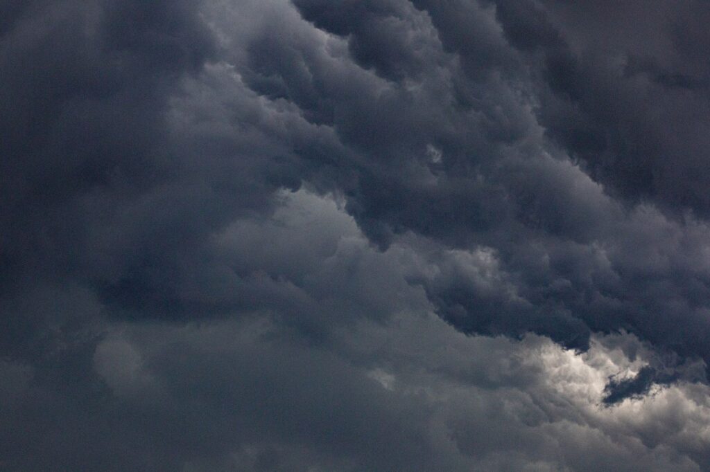 Moody sky filled with dense, dark clouds representing a dramatic atmosphere.