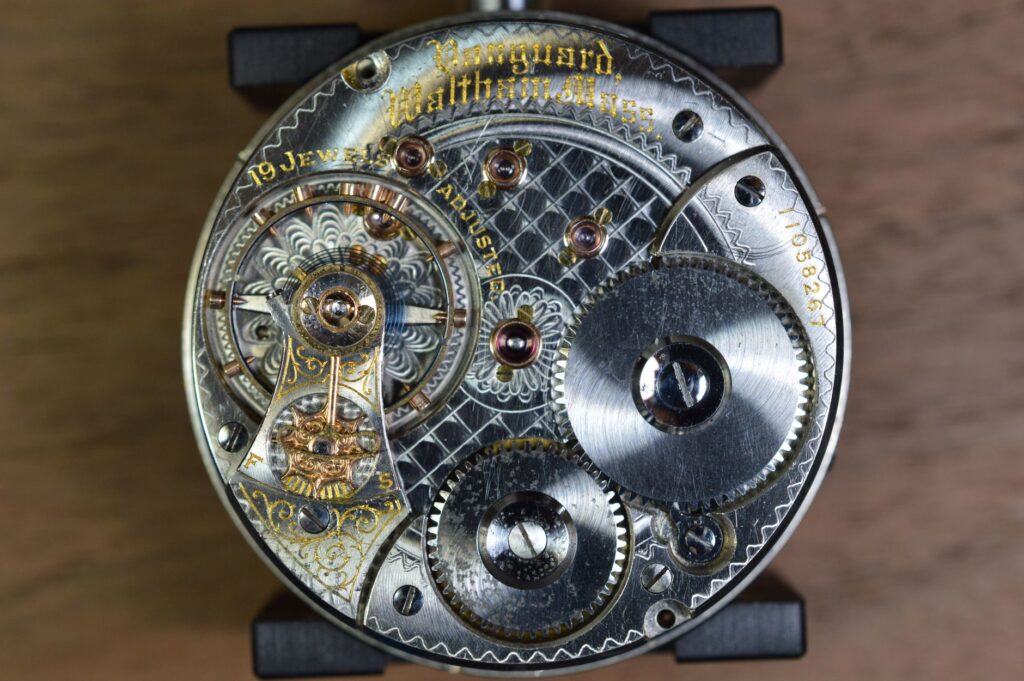Close-up of an antique clock mechanism showcasing gears and intricate details, an image for Evolution Explains Design? Then Is God Unnecessary