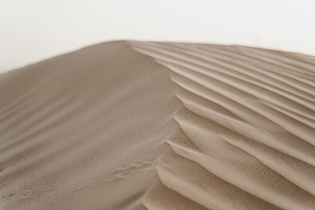 A beautiful close-up of sand dunes in a desert landscape, showcasing natural patterns.