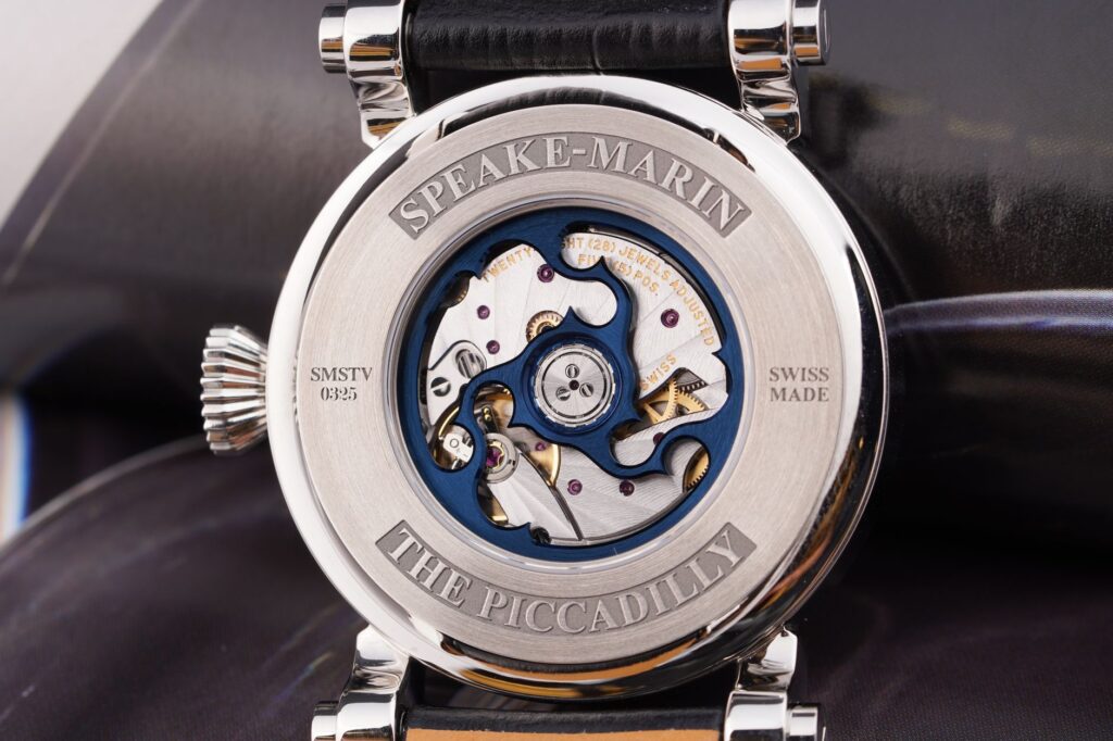 Close-up of a luxurious Speake-Marin watch showcasing intricate watchmaking mechanism.